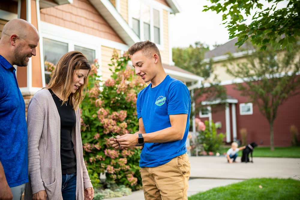 lawn care experts talks with customers