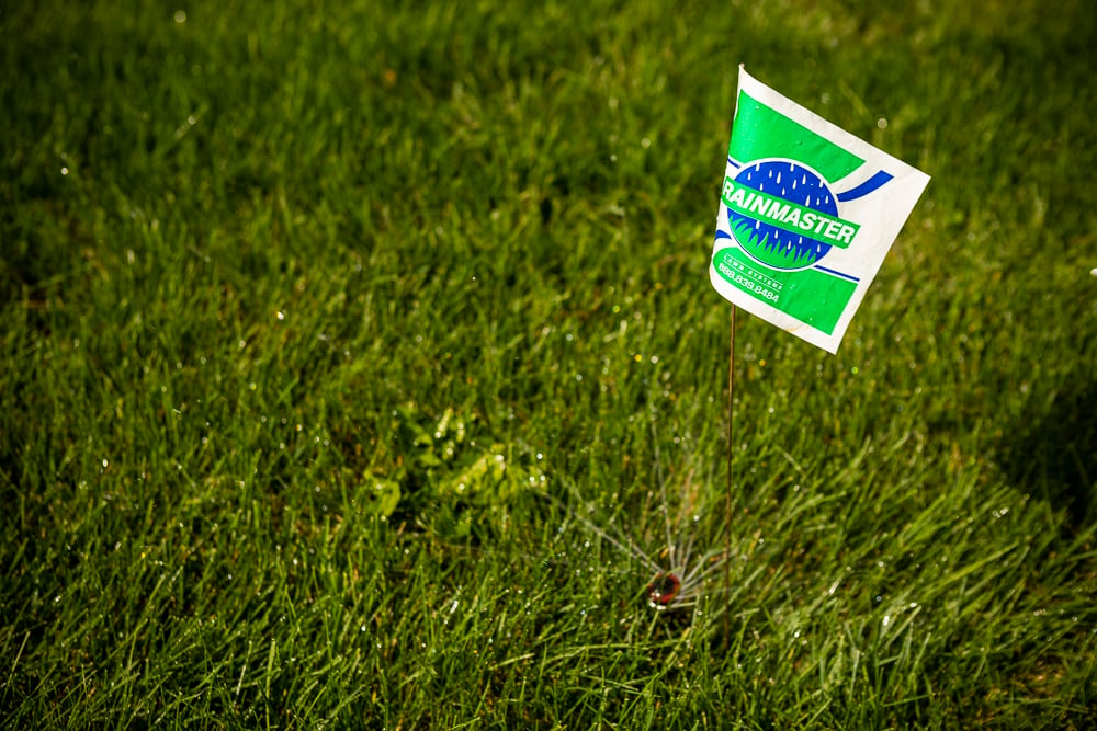 Lawn team flagging irrigation heads