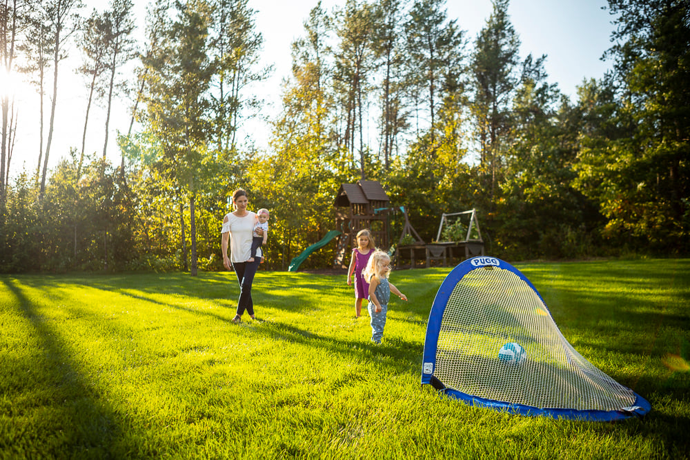 family plays in mosquito-free backyard