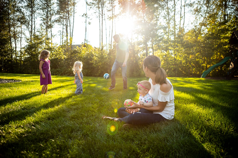 Family in lawn with mosquito and tick control services