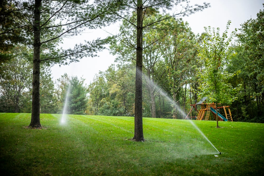 irrigation system watering lush lawn