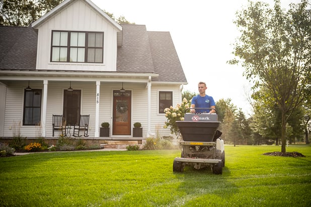 RainMaster lawn care technician treating lawn