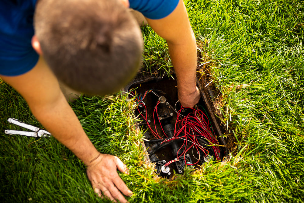 irrigation team repairs controls