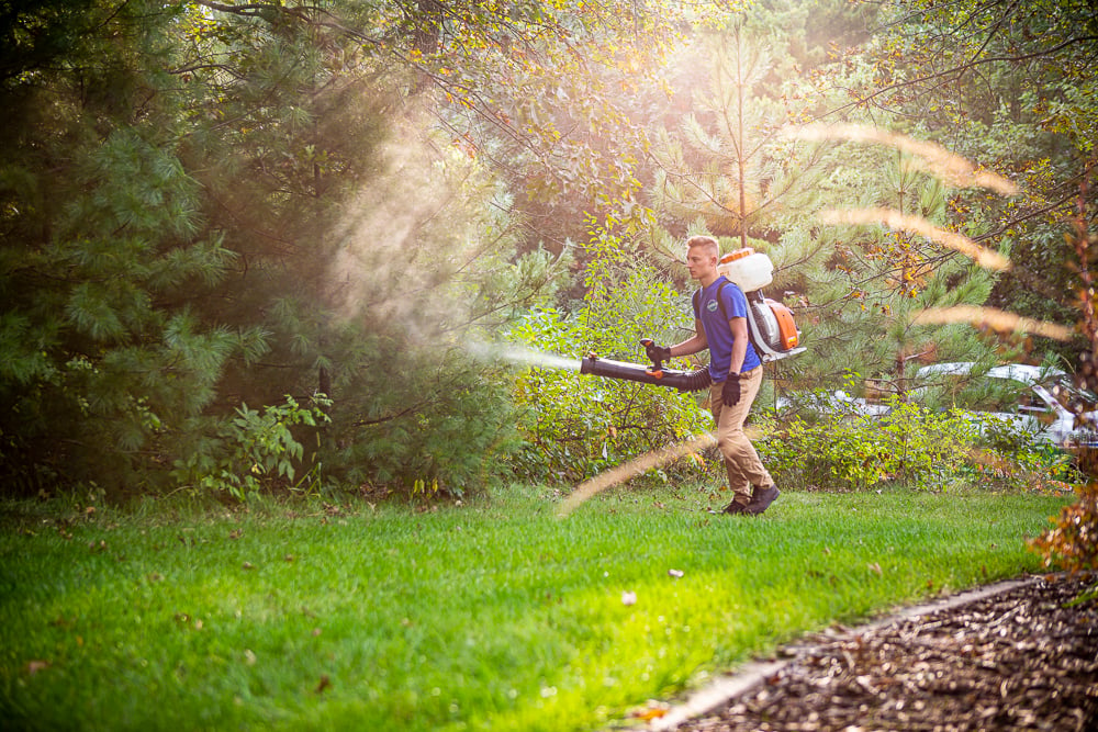 lawn team sprays barrier spray to reduce ticks