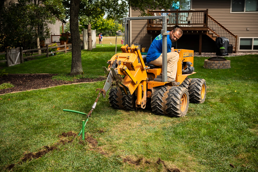 irrigation installation in lawn in summer