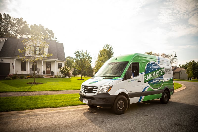 RainMaster lawn care van and nice lawn