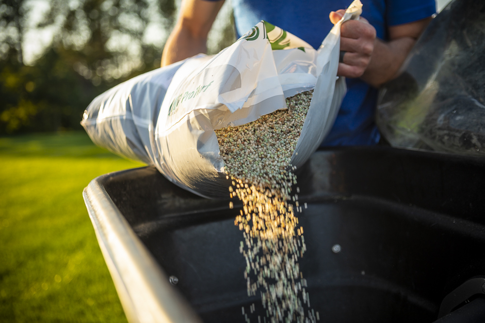 Granular Lawn Fertilizer being poured